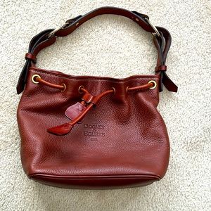 Beautiful Brown Dooney & Bourke drawstring bag. Good pre-owned condition.